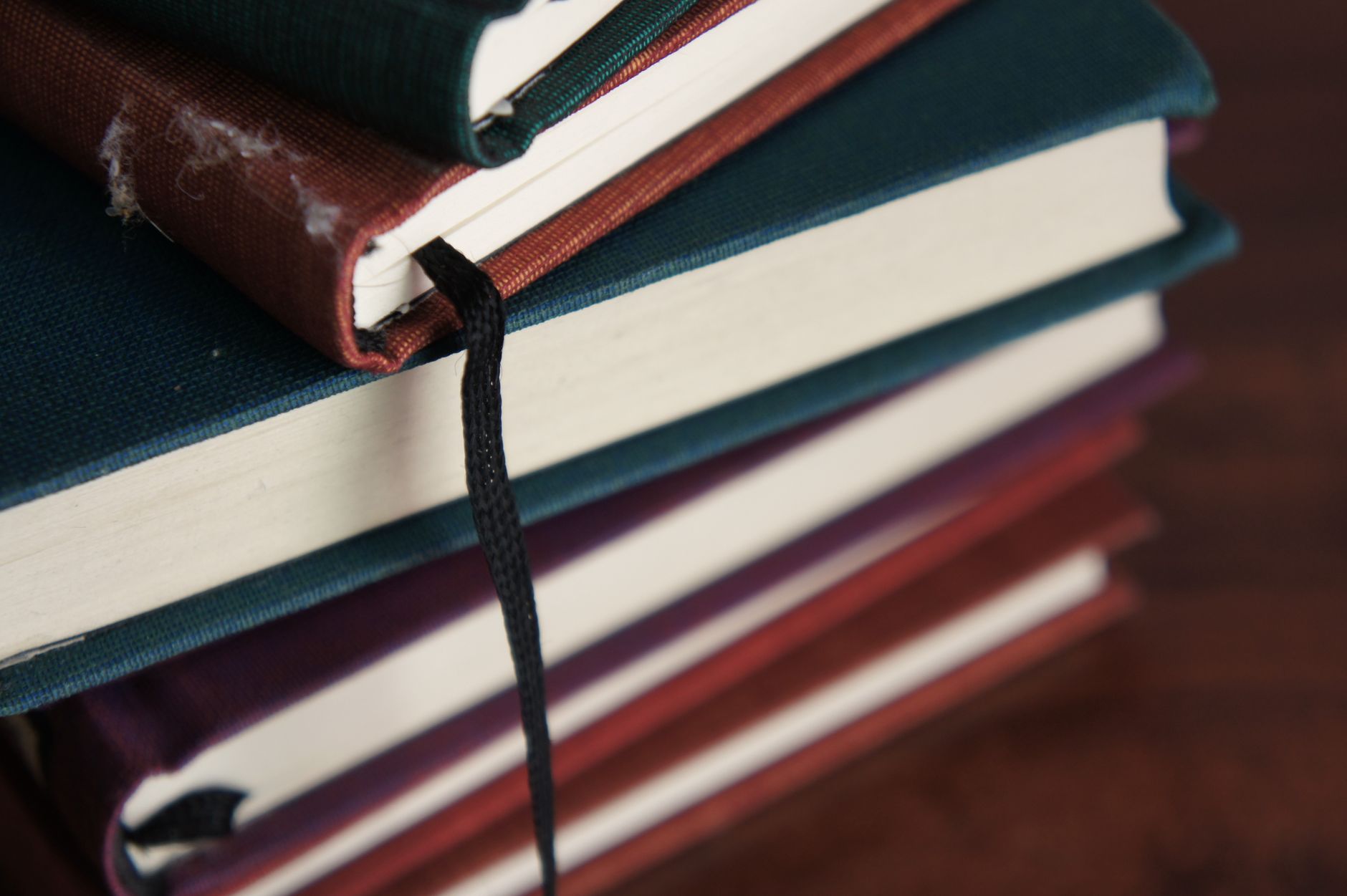 close up photography of books on wooden table